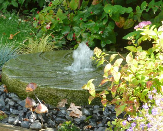 large-granite-millstone-water-feature-in-hook-hampshire-2